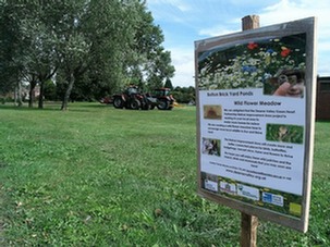 Signage explaining to the public what is being done to promote wildlife in the amenity grassland